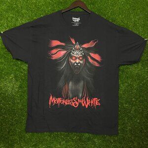 Motion is in White Rock band T-shirt, size 2XL